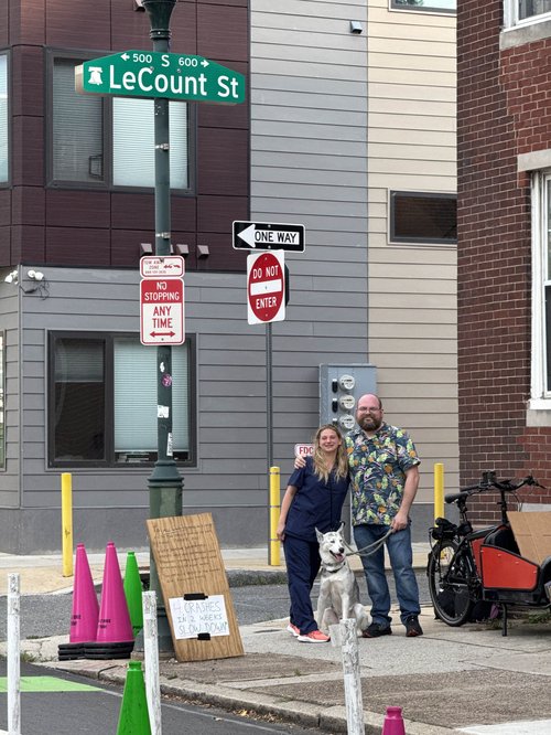 Neighbors pose with new signs at LeCount